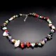 A set of beads and a bracelet on a fishing line with a lock made of natural stone Gems