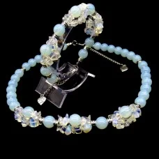 A set of beads and a bracelet on a fishing line with a lock made of natural stone Moonstone