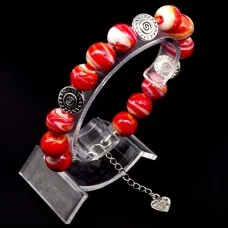 Glass beads bracelet. Diameter -12mm, color-red. The basis of the bracelet is a double strong fishing line with a lock, accessories - metal in silver, girth: 20cm+