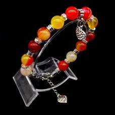 Bracelet made of natural stone "Sardonyx" with a pendant. Metallic thread, silver metal fittings. Bead diameter: 10mm, girth: 19.5cm+