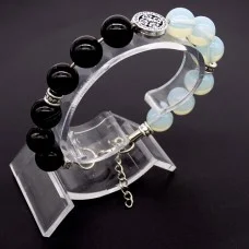 Bracelet made of natural stone *Moonstone-Agate* base metallized thread. Bead diameter: 10mm, girth: 18.5cm+