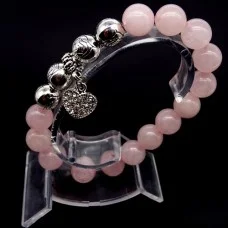 Bracelet on an elastic band made of natural stone "Rose quartz" with a pendant, metal fittings in silver. Bead diameter: 10/10mm, girth: 19cm+