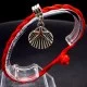 Bracelet red thread amulet against the evil eye with a pendant *shell scallop* metal color: silver, size: universal 12-19cm