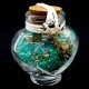 Marine souvenir glass bottle in the shape of a heart